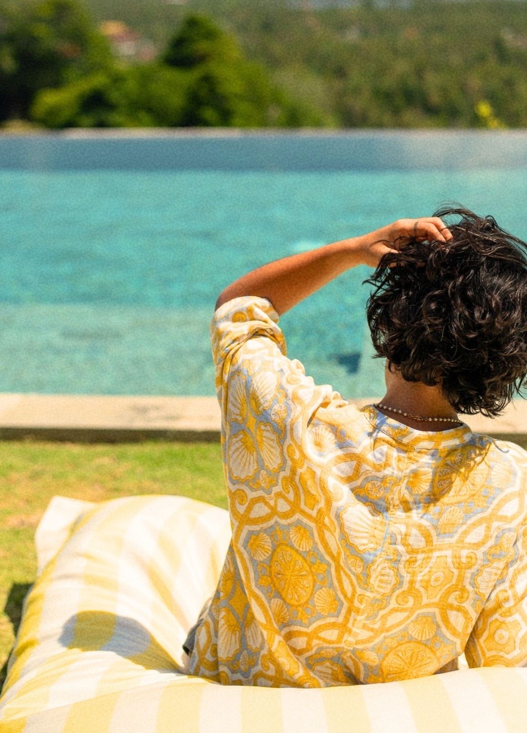Azul Shell Kimono Shirt, printed kimono shirt, model by pool, blue and yellow print, organic cotton