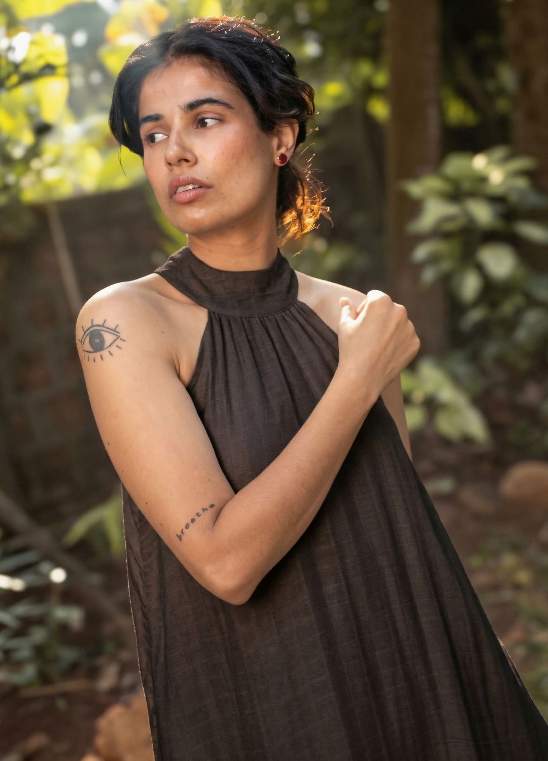 Black sleeveless halter-neck maxi dress with a relaxed, flowing silhouette