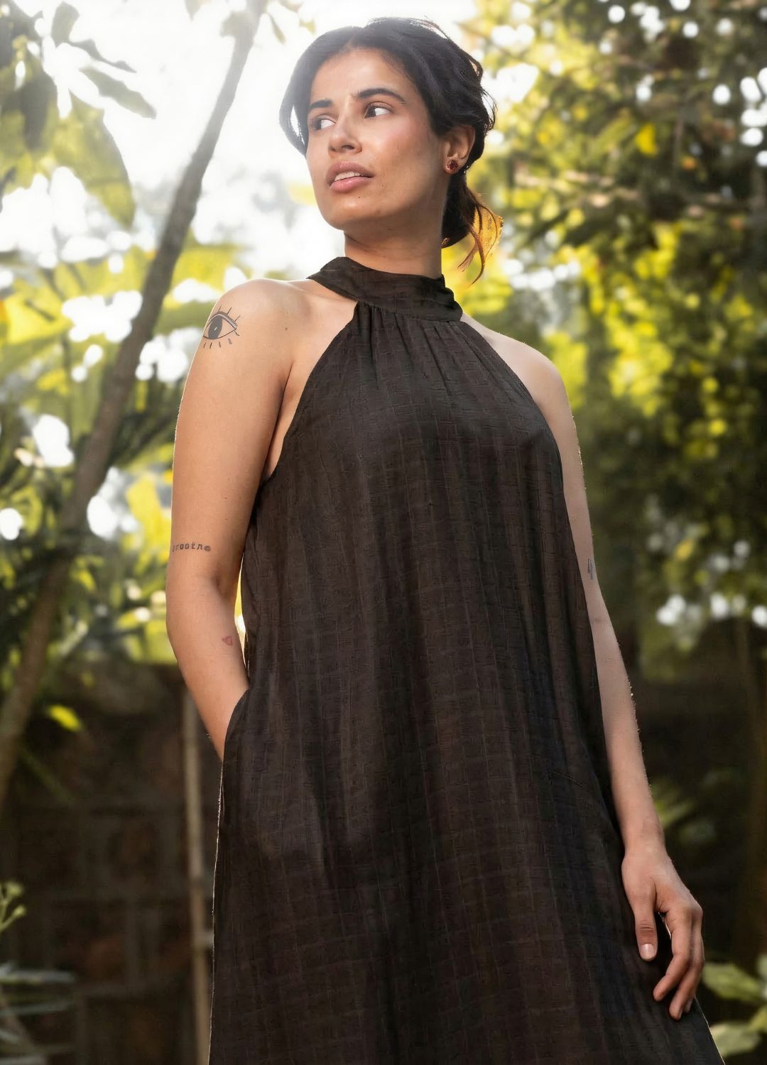 Black sleeveless halter-neck maxi dress with a relaxed, flowing silhouette